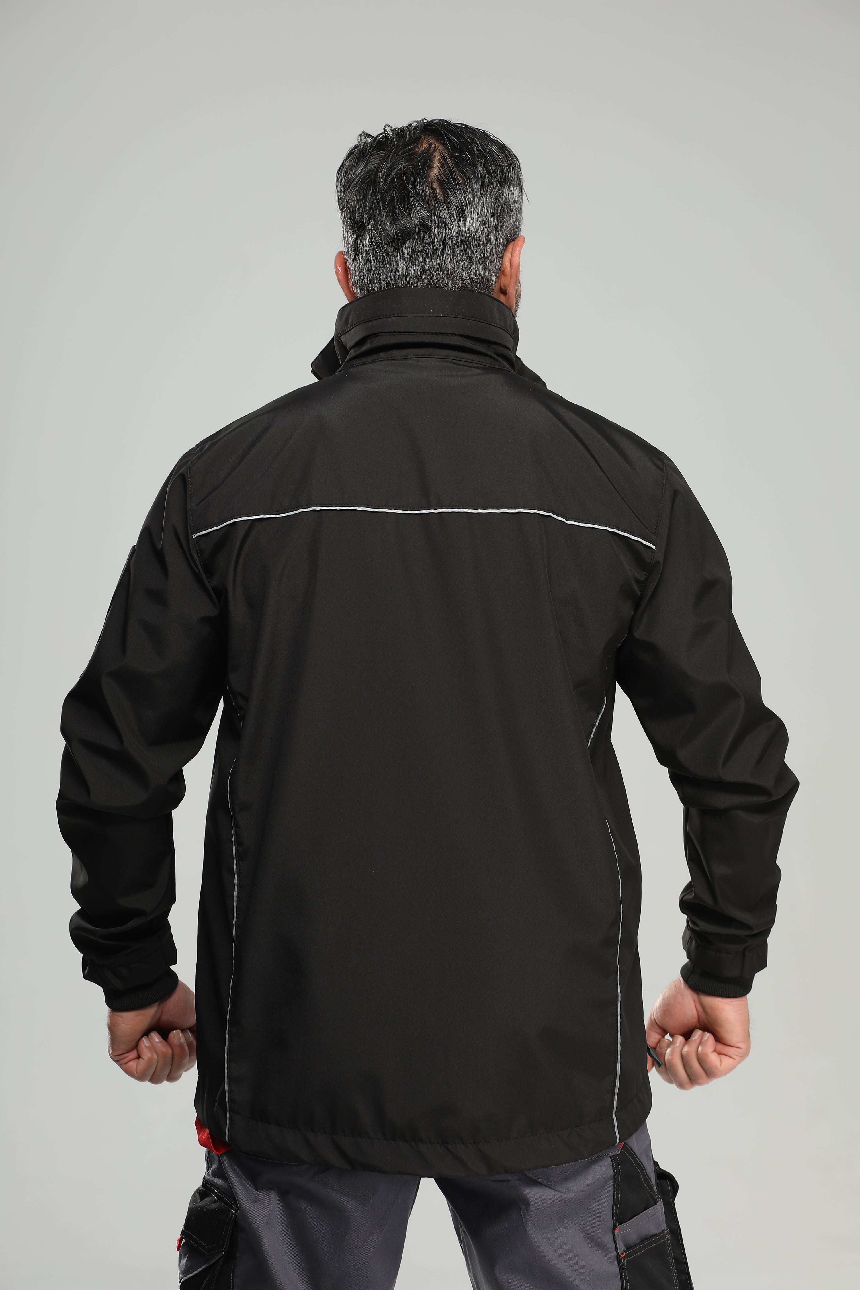 Black rain jacket with reflective piping